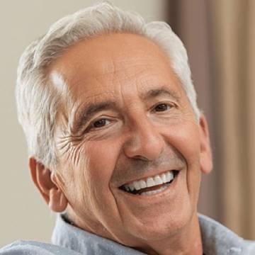 Old man smiling after oral cancer screening in Mandeville, LA | Alvarez Dental
